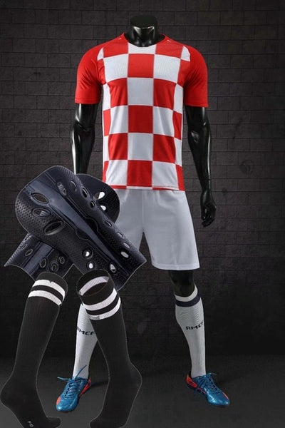Men running Training Uniforms set with socks and shin guard